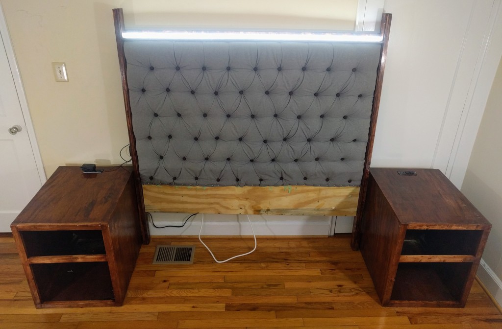 Image of a semi-finished tufted headboard w/ night stands. It includes integrated outlets, LED, dimmable lighting and selft-supporting structure.