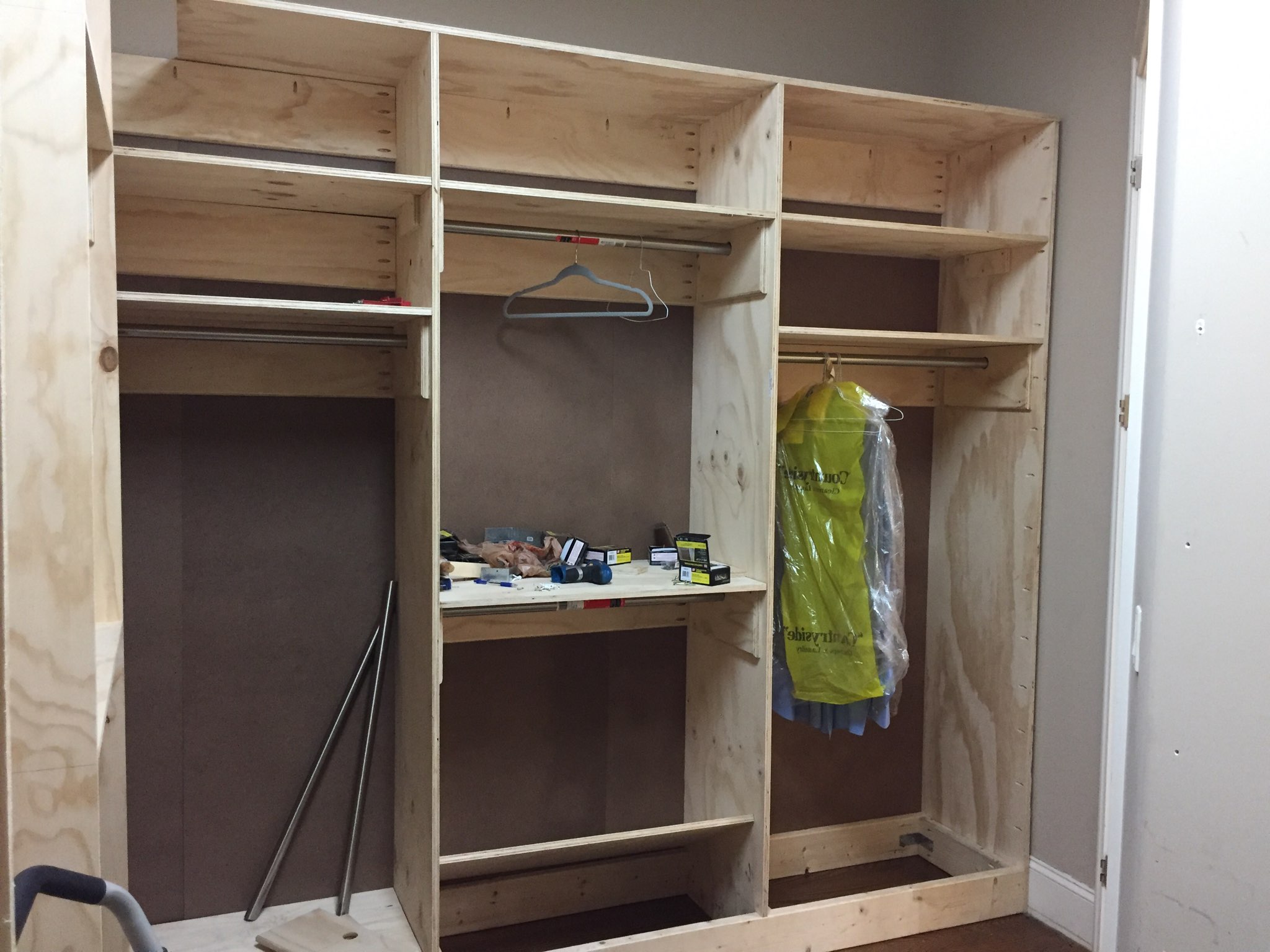 Picture of one of four sections of the walk-in closet. Size of this section is 9ft x 8ft (LxH), i.e., excluding a 2ft tall compartment (not shown) that fits at the top.