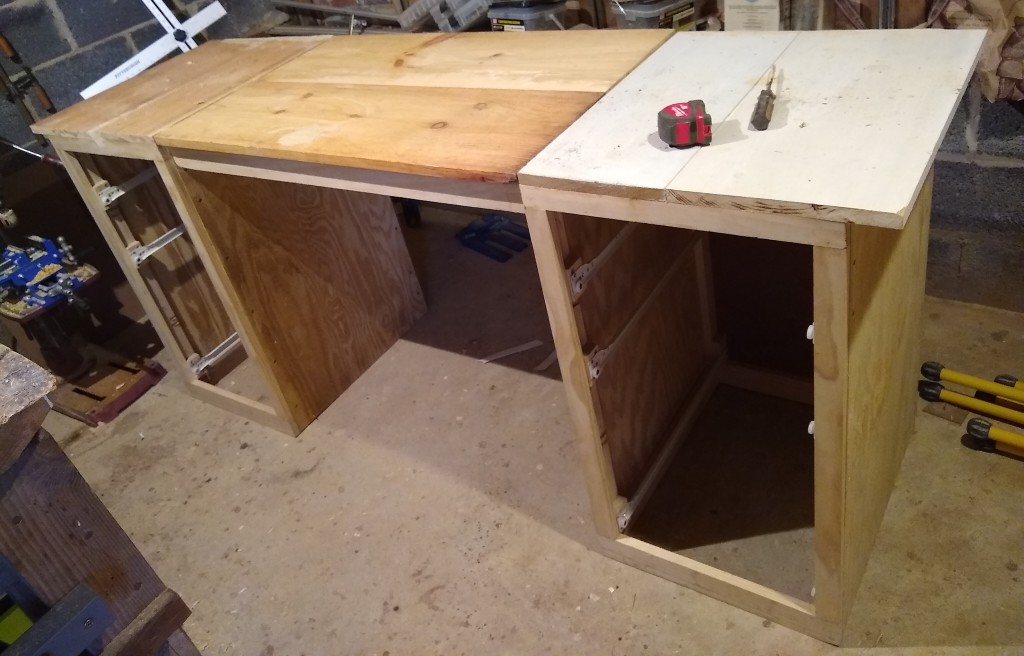 Dry-run of desk assembly. The middle section is fastened to the file cabinets using 1/4"-20 fasteners